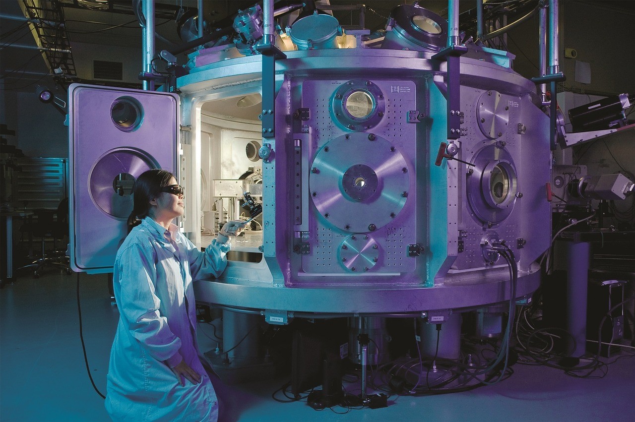 Girl working inside a lab machine